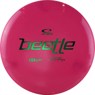 A pink Latitude 64 Biogold Beetle disc golf utility disc.