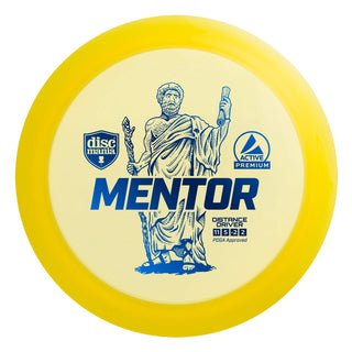 A yellow Discmania Active Premium Mentor disc golf distance driver.