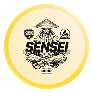 A yellow Discmania Active Premium Sensei disc golf putter.