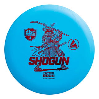 A blue Discmania Active Shogun disc golf distance driver.