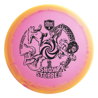 A pink and orange Discmania C-Line Glow Horizon FD Show Stopper 2 disc golf fairway driver -  Ella Hansen signature series.