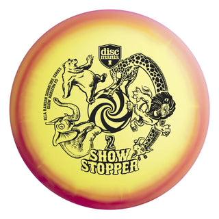 A yellow and red Discmania C-Line Glow Horizon FD Show Stopper 2 disc golf fairway driver -  Ella Hansen signature series.