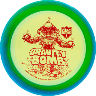 A green and blue Discmania C-Line Horizon PD2 Gravity Bomb disc golf distance driver - Gavin Babcock signature series.