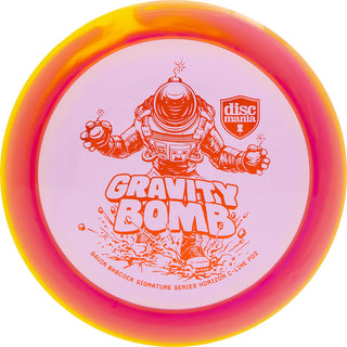 A purple and yellow Discmania C-Line Horizon PD2 Gravity Bomb disc golf distance driver - Gavin Babcock signature series.