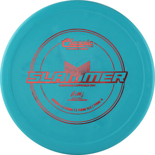 A turquoise Dynamic Discs Classic Blend Sockibomb Slammer disc golf putter.