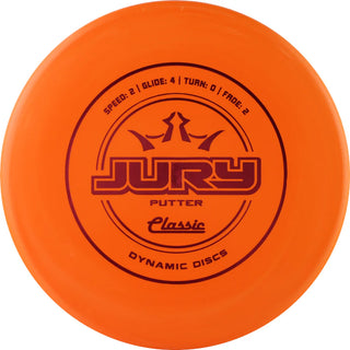 An orange Dynamic Discs Classic Jury disc golf putter.