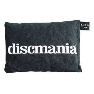 A black Discmania disc golf sportsack with a white Discmania text logo printed on it.
