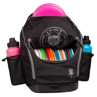 Front view of a black open Discmania Fanatic 2 disc golf backpack.