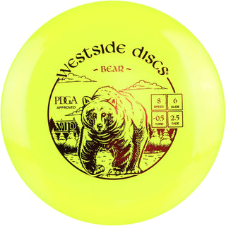 A yellow VIP Bear disc golf disc.