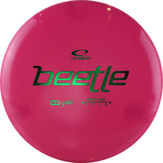 A pink Biogold Beetle disc golf disc.