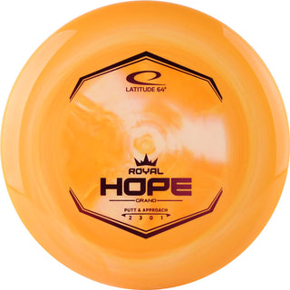 An orange Grand Hope disc golf disc.