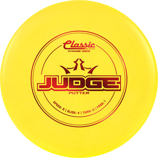 A yellow Classic Blend Judge disc golf disc.