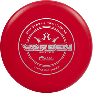 A red Classic Warden disc golf disc.