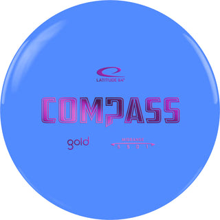 A blue Gold Compass disc golf disc.