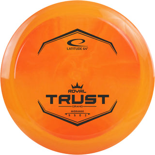 An orange Grand Trust disc golf disc.