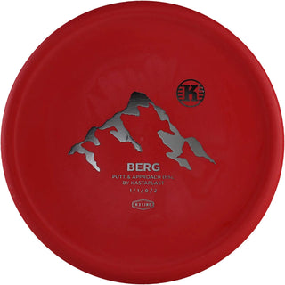 A red K3 Berg disc golf disc.