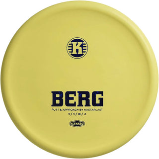 A yellow K3 Hard Berg disc golf disc.