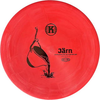 A red K3 Järn disc golf disc.