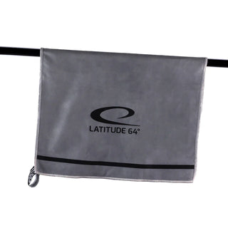 A gray towel with Latitude 64's logo in black on it.