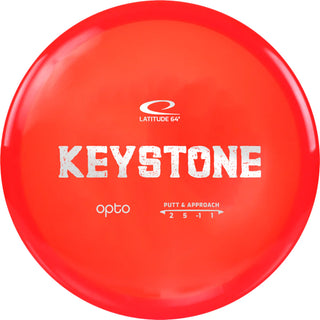 A red Opto Keystone disc golf disc.