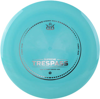 A turquoise first run Supreme Trespass disc golf disc.