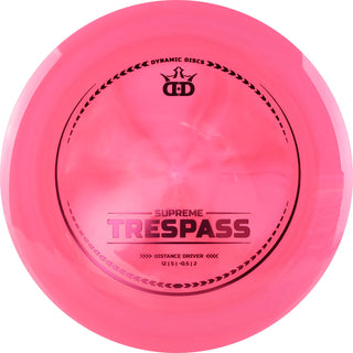 A red Supreme Trespass disc golf disc.