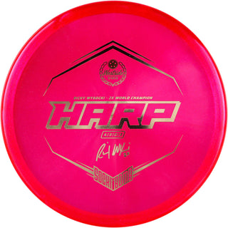 A red VIP Ice Glimmer Harp disc golf disc.